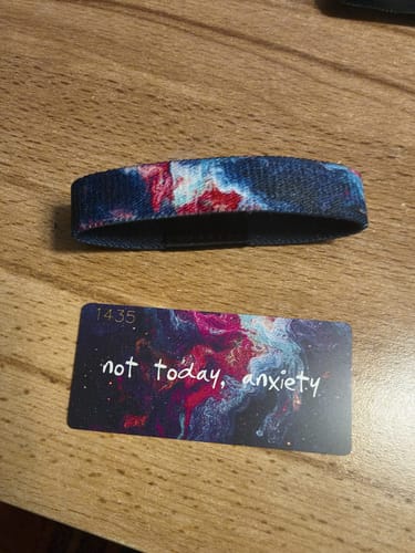 Customer's Not Today, Anxiety Bracelet with a colorful pattern, shown next to its accompanying 'not today, anxiety' card.