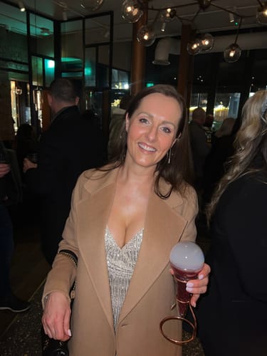 Reviewer smiling, showing her glowing skin after using the Marula Magic Duo facial oil.