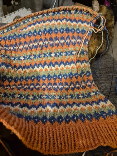 Reviewer's close-up of a colorful patterned knitting project made from the Ladies Box.