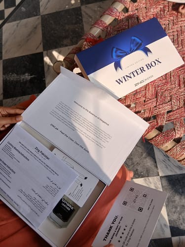 Customer unboxing their blue and white 'WINTER BOX' packaging for the OUD Supreme BUNDLE.
