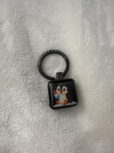 A customer's black Just Chill Zoxlox, showing a close-up of the square charm with a penguin eating a popsicle.