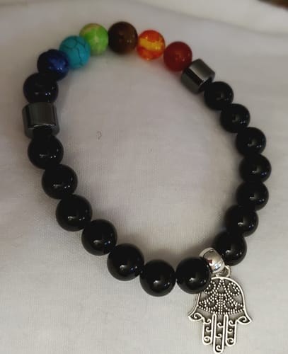 Customer's beautiful crystal bracelet with black beads, a row of colorful stones, and a silver Hamsa charm.