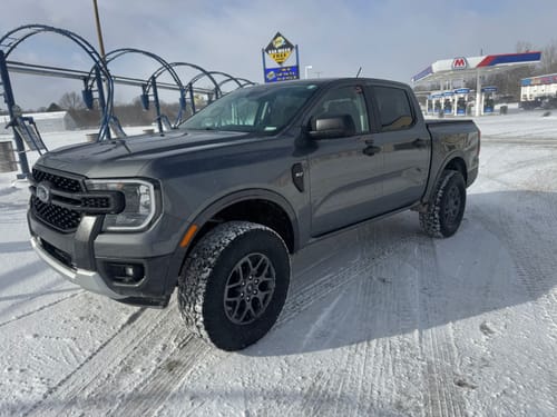 Customer's gray Ford Ranger in the snow, showing the wider stance from the 1.5 inch wheel spacers.