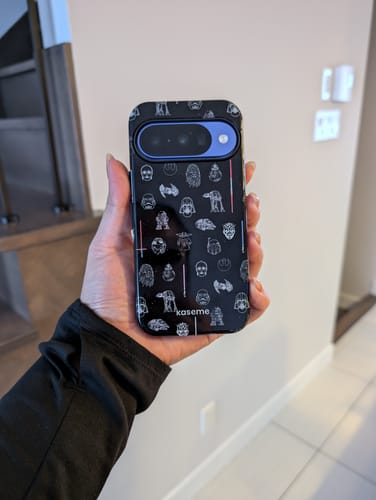Customer holding a blue Google Pixel phone in the stylish black Hyper Space case with a Star Wars theme.