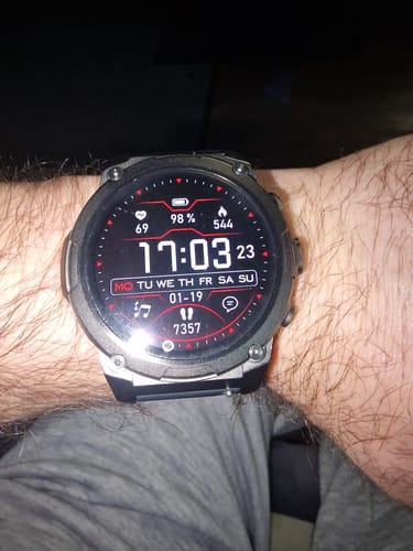 Reviewer's Gard Pro Ultra 3 smartwatch on their wrist, showing the digital watch face with various fitness metrics displayed.