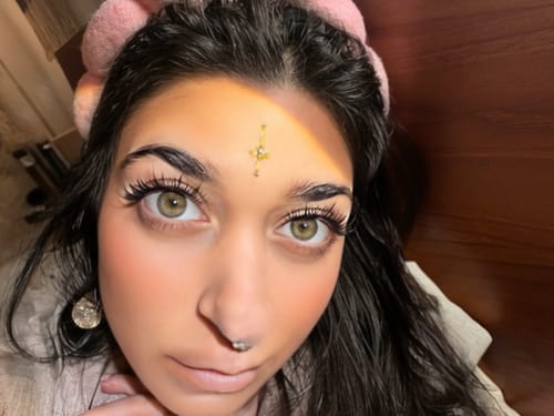 Close-up of a reviewer's eyes showcasing a full, wispy look created with Pro Curated Lash Bundles.