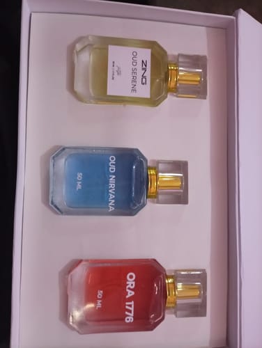 Customer's OUD Supreme BUNDLE showing the three included perfumes—Oud Serene, Oud Nirvana, and Ora 1776—inside the box.
