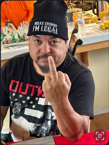 Customer wearing the black 'Relax Gringo I'm Legal' Cuffed Beanie indoors.