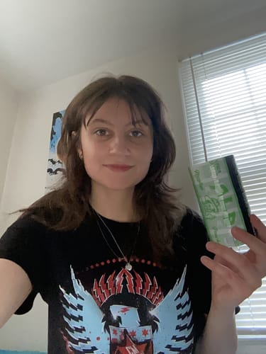 Reviewer holding up a bundle pack of Peppermint Nicotine Pouches.