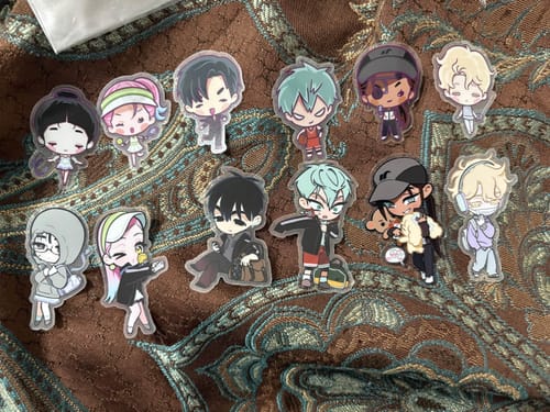 Customer's collection of cute, chibi-style stickers from the Alien Stage Sport Series set spread across a patterned surface.