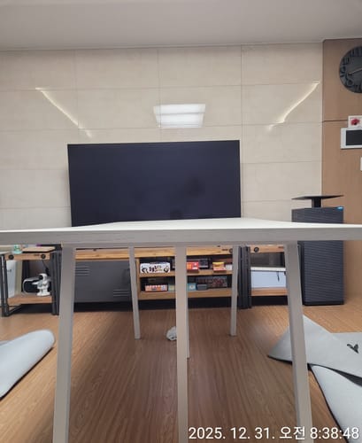 Customer installation photo of the HAY Loop Stand Table.