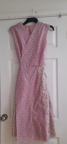 Reviewer's finished pinafore dress made from the pink floral Daffodil Delight Cotton Poplin Fabric.