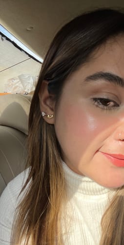 Reviewer's close-up photo showing smooth, glowing skin after using the Bakuchiol Resurfacing Night Serum.