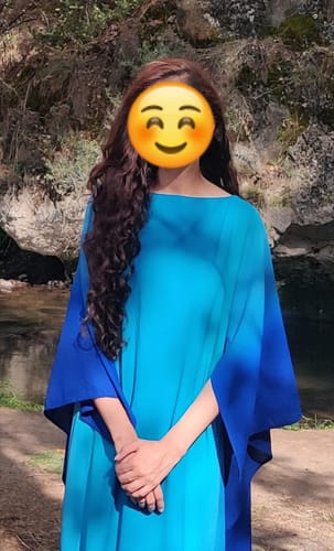 Reviewer showing results of Rosemary Oil on their long, curly hair.