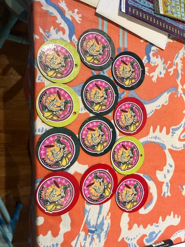 Customer's colorful custom vinyl stickers shown with various border colors.