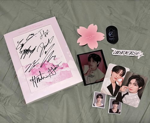 Customer's signed EPEX 2nd Album displayed with included photocards and merchandise.