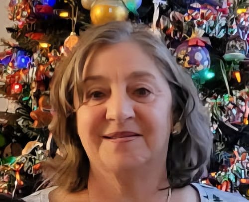 Customer showing her face with smooth skin after using the Grass Fed Tallow & Honey Balm.