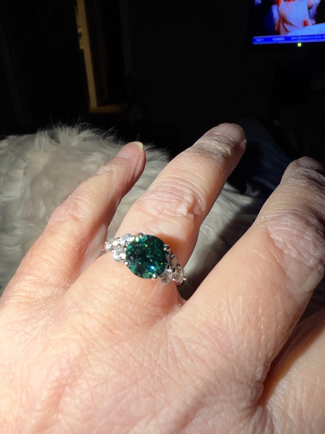 Customer photo review of Green Moissanite Side Stone Engagement Ring
