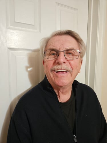 Customer smiling to display his new, natural-looking Pop On Veneers.