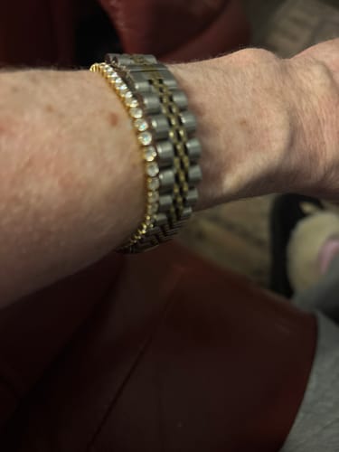 Close-up of a customer wearing the sparkling Diamond Tennis Bracelet stacked with a watch.