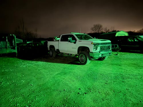 Customer's white Chevy Silverado 2500HD parked at night after installing the adjustable torsion bar key to lift the front end.