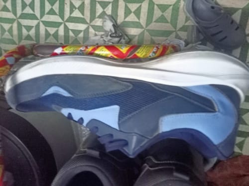 Customer's side view of the blue and grey Bacca Bucci Jump sneaker, showing its thick white sole.