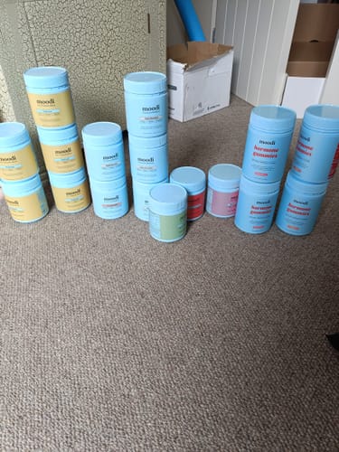 Customer's large collection of Mylk Chocolate and other products from the brand, stacked on the floor.