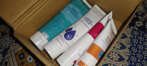 Reviewer's 24 Hour Glow Pack products displayed inside the open shipping box.
