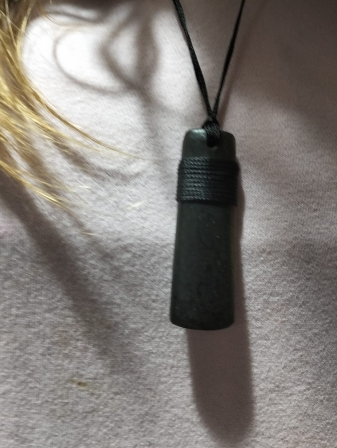 Customer photo review of Genuine Ngai Tahu Pounamu Wrapped Greenstone Toki Necklace 6cm