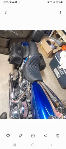 Customer's new black Saddlemen Profiler Seat with diamond stitching installed on their blue motorcycle.