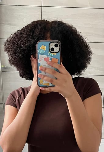 Customer photo review of CurlyMe Pre-bleached Wear Go Glueless Afro Kinky Curly Pre-cut HD Lace Wig Pre-plucked