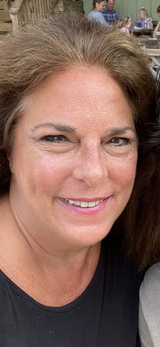 Reviewer's face showing smooth, hydrated skin after using Grass Fed Tallow & Honey Balm.