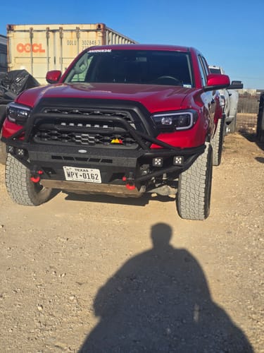 Customer's red Toyota truck with a wider stance from installing the 1.5 inch hubcentric wheel spacers.