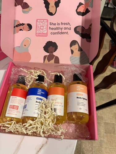 Customer's Body Oil Gift Set with four bottles displayed in an open, branded pink box.