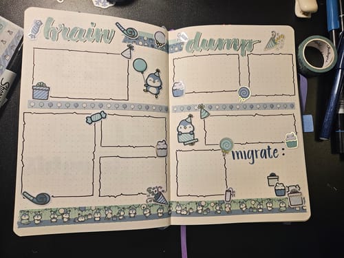 Reviewer's journal brain dump spread decorated with blue penguin stickers and washi tape from the Ultimate Subscription.