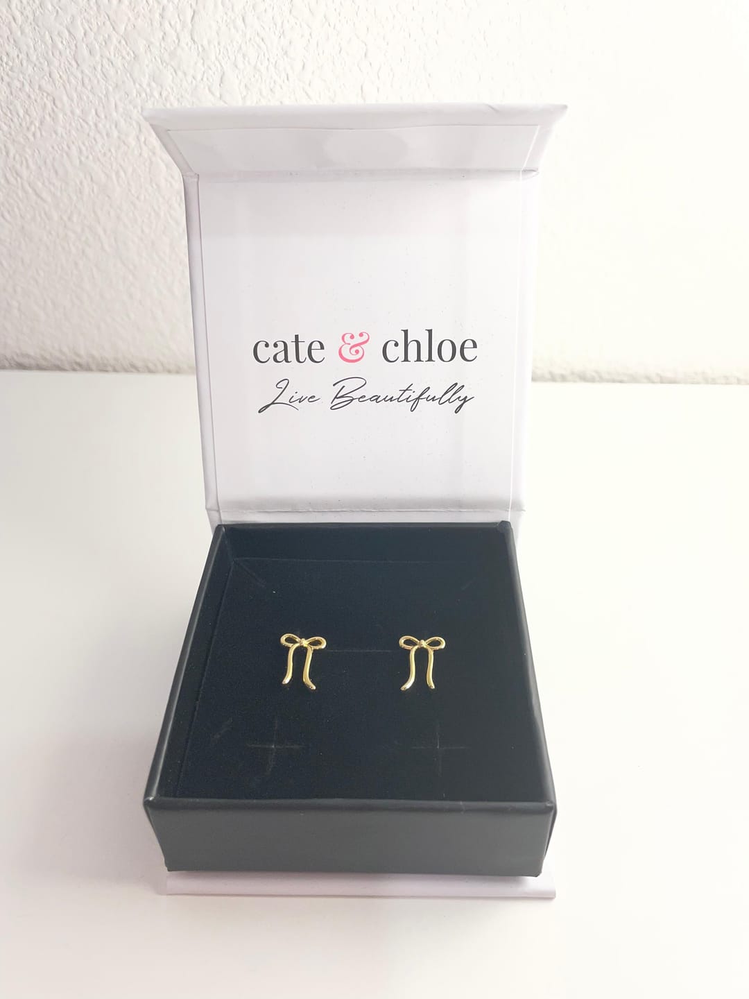 Customer photo review of Lola 18k White Gold Plated Ribbon/Bow Drop Earrings