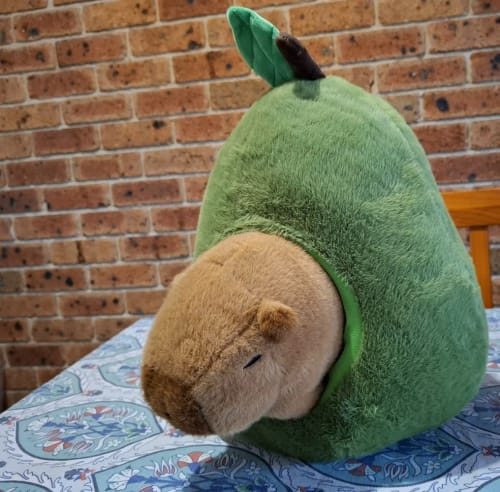 Customer photo review of Avocado Capybara Plush Pillow