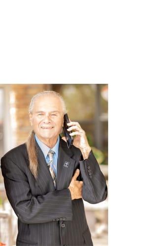 A happy reviewer of Emma, smiling in a pinstripe suit.