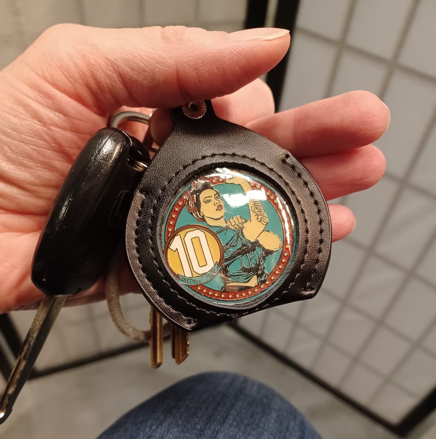 Customer photo review of Rosie Recovery Strength 10 Year AA/NA Medallion - Tri-Plate Ten Year Chip/Coin