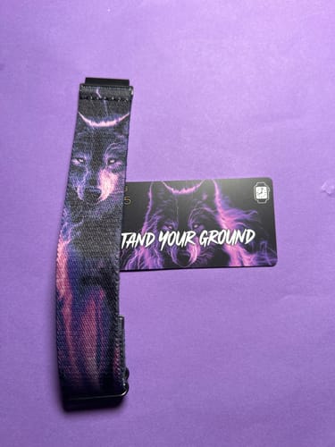 Customer's Stand Your Ground Watch Band with a purple wolf graphic, shown next to its matching card.