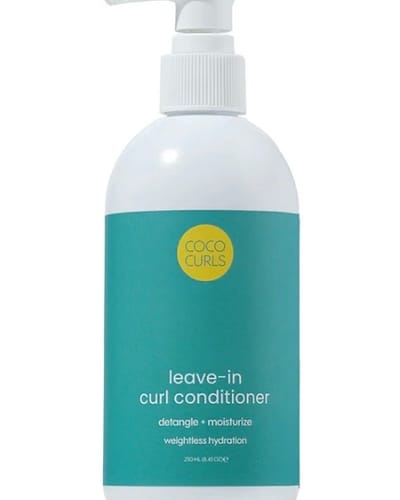 Customer's Leave-in Curl Conditioner in a white pump bottle with a teal label.