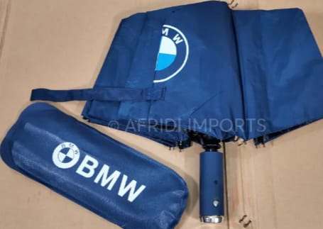 Customer's folded blue BMW windproof umbrella shown next to its matching pouch.