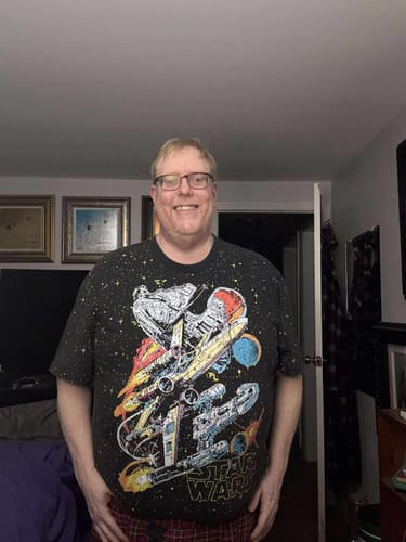 Reviewer wearing the Star Wars™ "Built to Rebel" vintage tee, showing the colorful graphic of iconic ships.