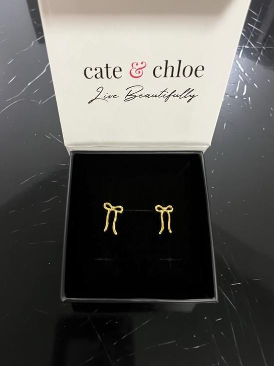 Customer photo review of Lola 18k White Gold Plated Ribbon/Bow Drop Earrings