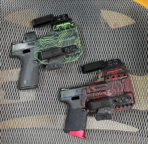 Customer's two XIPHOS ELITE holsters, one with a green topo pattern and the other with a red topo pattern.