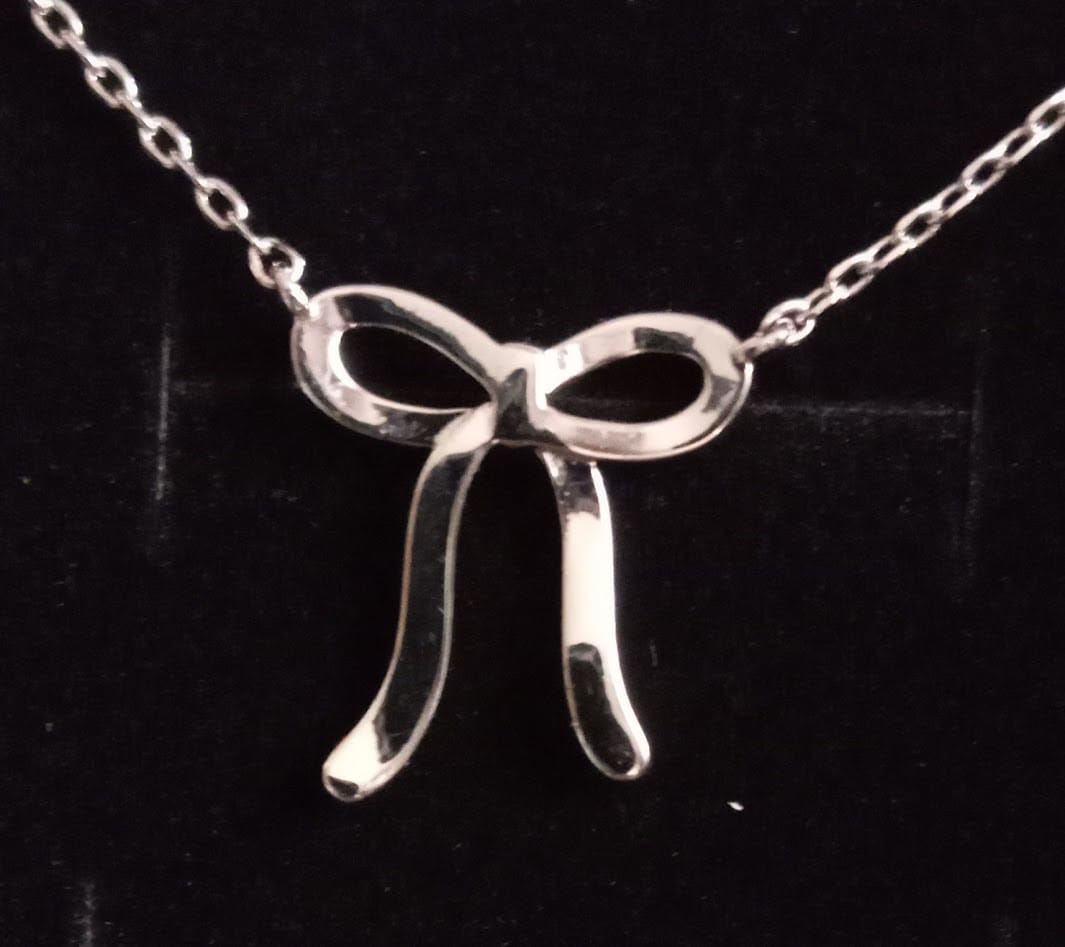 Customer photo review of Lola 18k White Gold Plated Ribbon/Bow Pendant Necklace