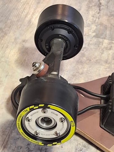 Customer's new replacement motor installed on the rear truck of their V3 MAX electric longboard.