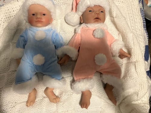 Customer photo review of 12 Inch Silicone Baby Doll Pink Fluff Ball with Santa Style Hat Clothes For Baby Dolls, Velcro Plush Clothing Small Doll Outfits