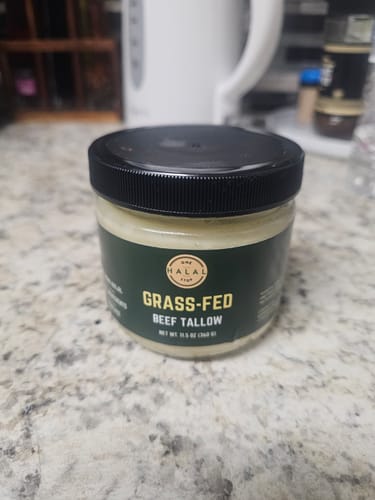 Customer's jar of Grass-Fed Halal Beef Tallow sitting on a kitchen countertop.