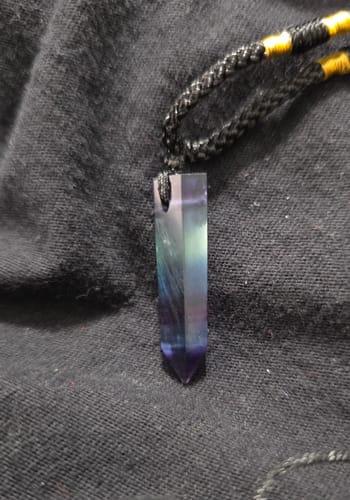Customer's close-up of the Natural Fluorite Necklace, showing the vertical crystal with purple and green bands.